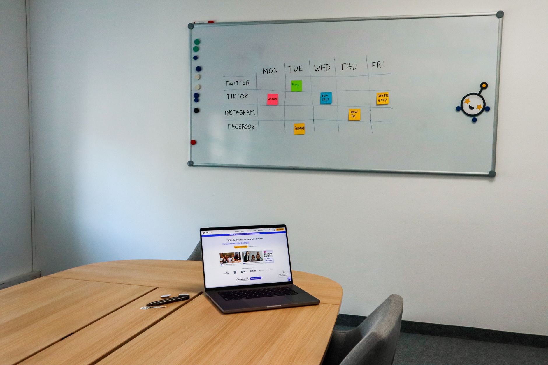 laptop showing social media scheduling calendar with upcoming posts