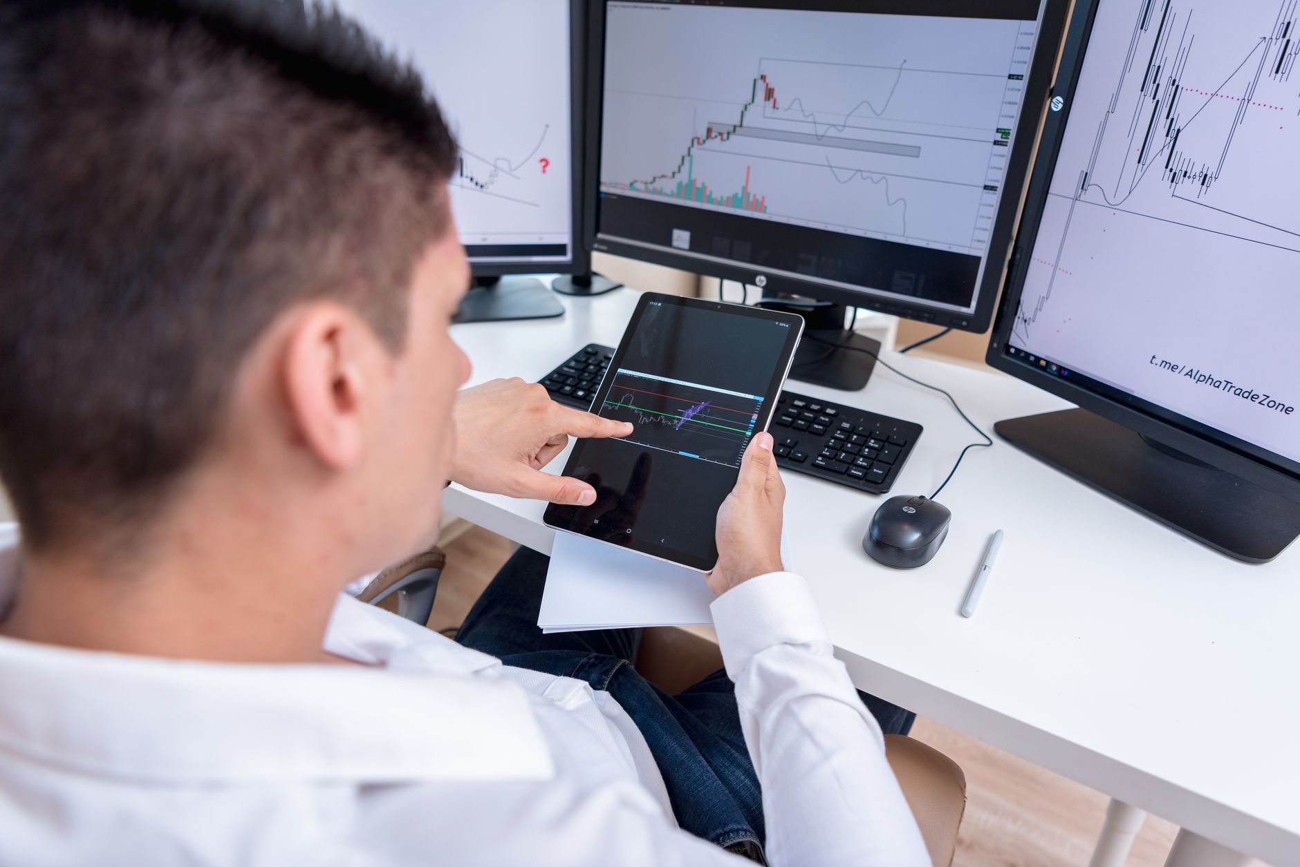A business owner approving automated bookkeeping entries on a tablet