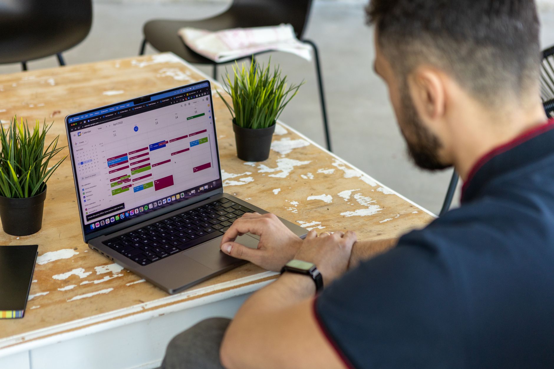a freelancer checking completed job details in a time tracking app on a laptop